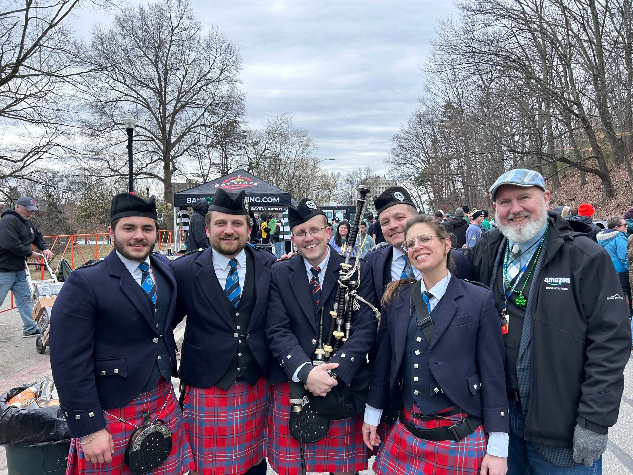Worcester Kiltie Pipe Band members at an outdoor event